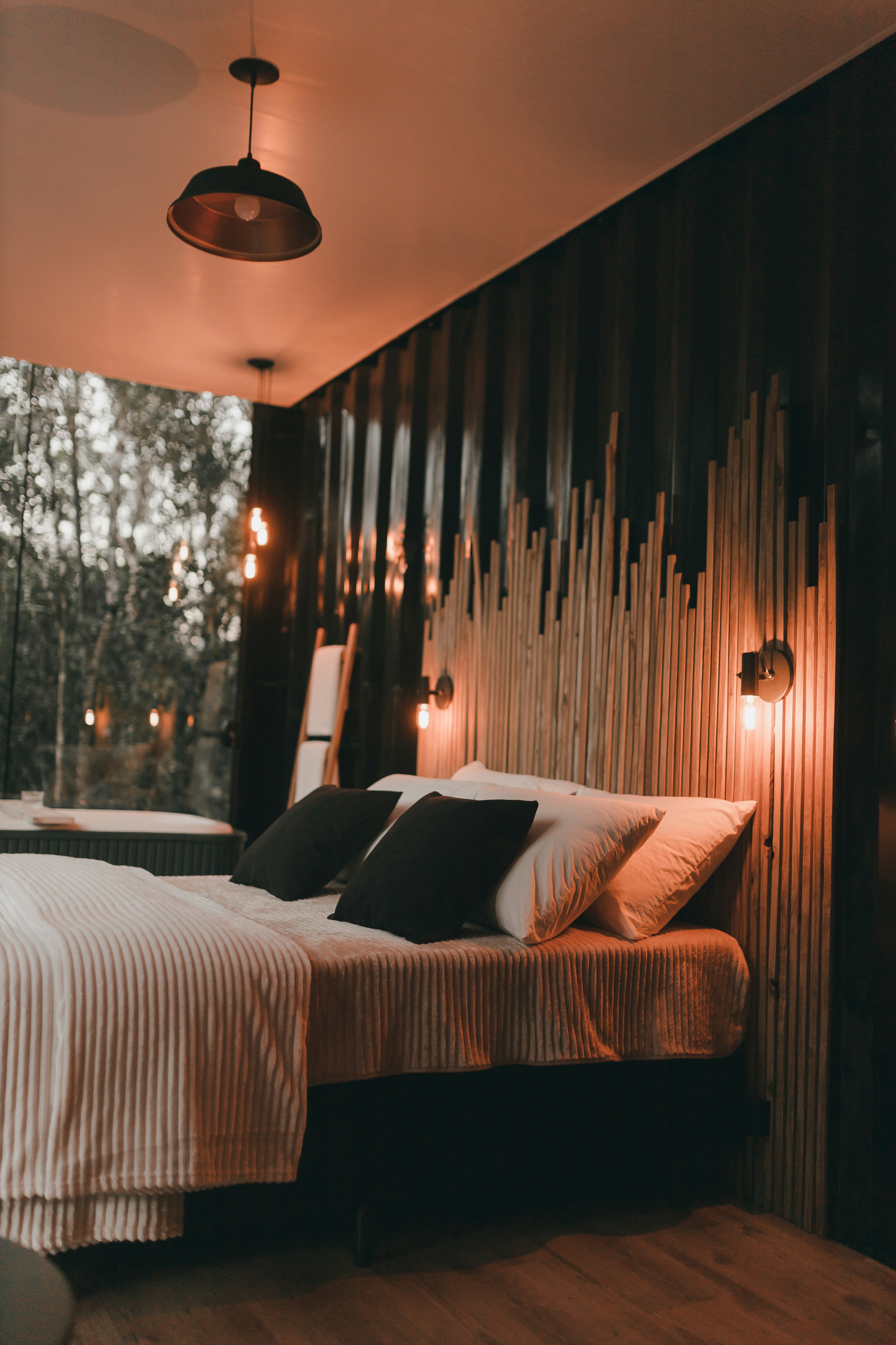 Bedroom with soft slatted backdrop